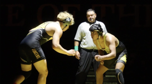 One of the top newcomers, sophomore Riken Ramos (left), faces off against a Godinez High School wrestler during a non-league home duel on Saturday, Dec. 14.